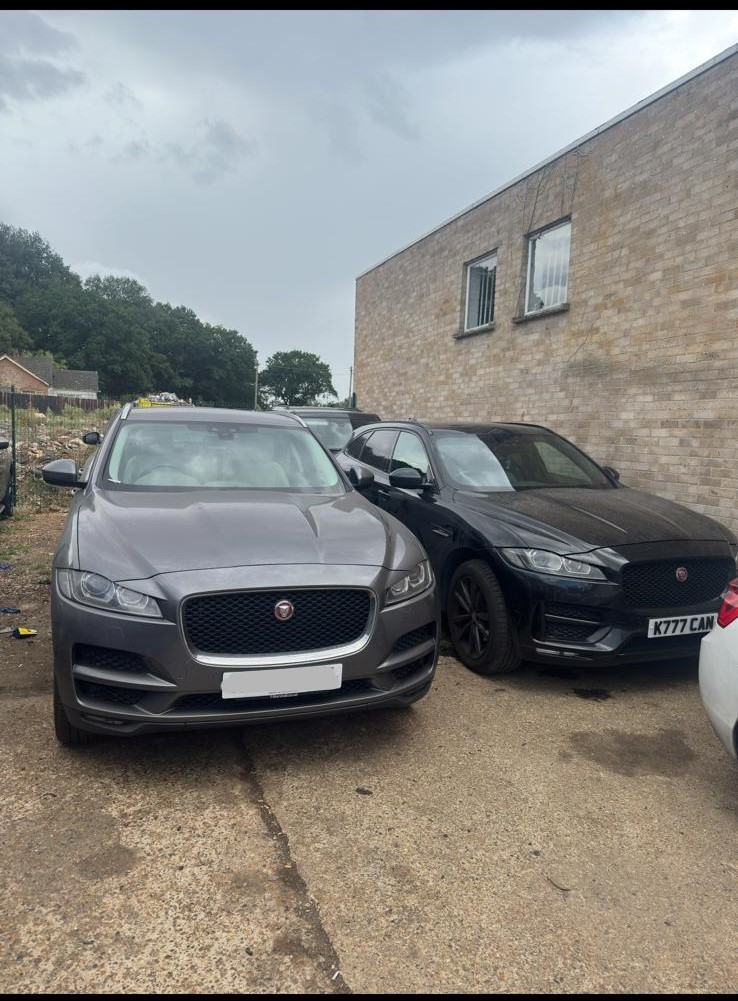 Grey Jaguar F-Pace and black Jaguar F-Type parked outside JLR Engine Specialists workshop – ready for engine service or rebuild with 12-month warranty